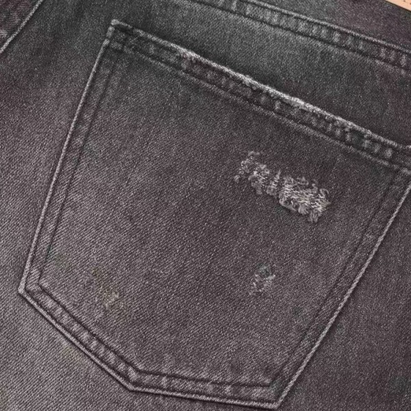 CELINE black washed jeans with holes