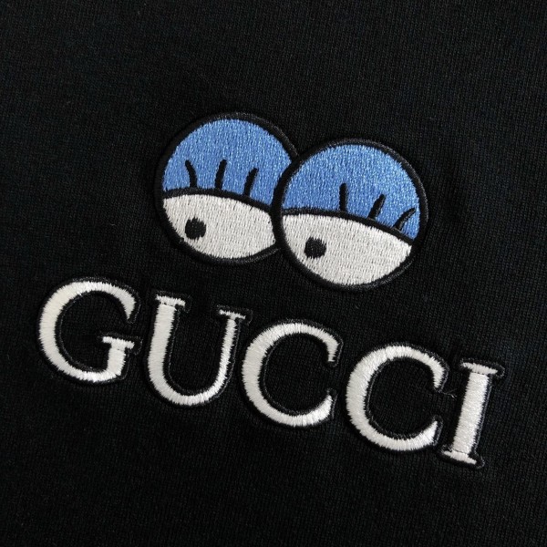Gucci Floral neckline embroidered polo shirt with cartoon lettering
